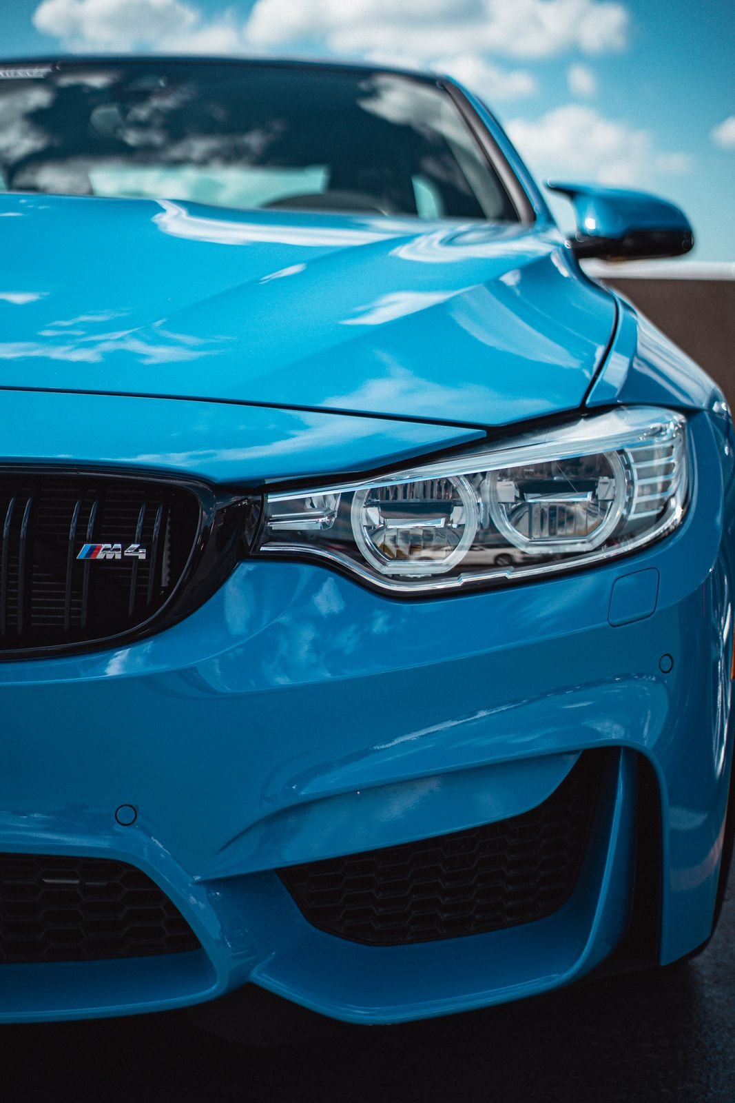 The front of a blue BMW M4